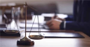 Person writing with a weight for an accidental attorney in brownsville