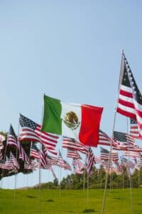 Mexican and USA flags showing the importance of a personal injury lawyer who speaks English and Spanish